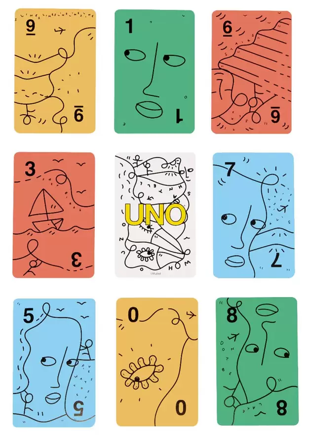 Colorful UNO Artiste deck reimagined by Shantell Martin, featuring whimsical black line drawings of faces, objects, and abstract shapes on bold backgrounds in yellow, green, red, blue, and white.